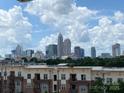 Daytime view of the Charlotte skyline from an apartment building with bright cloudy skies at 12119 Brooklyn Ave, Charlotte, NC 28204