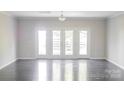 Spacious living room with hardwood floors and plenty of natural light at 147 Fesperman Cir, Troutman, NC 28166