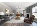 Spacious living room with hardwood floors and a cozy fireplace at 822 N Rocky River Rd, Monroe, NC 28110