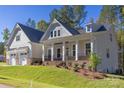 Two-story house with a front porch, two-car garage, and nicely landscaped yard at 1025 Patterson Farm Rd, Mooresville, NC 28115