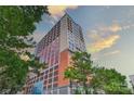 High-rise building exterior with orange brick and glass at 222 S Caldwell St # 2007, Charlotte, NC 28202