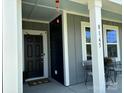 Inviting front porch showcasing the house number and outdoor seating at 8165 Annsborough Nw Dr, Concord, NC 28027