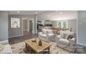 Open-concept living and dining area with neutral tones and ample natural light at 55 Shannon Park Cir, Taylorsville, NC 28681