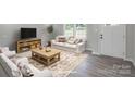 Living room with comfortable seating and a view of the front yard at 55 Shannon Park Cir, Taylorsville, NC 28681