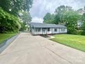 Well maintained exterior with a large driveway and a spacious front lawn at 1586 Kenlane Dr, Hickory, NC 28601