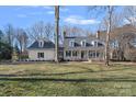 House exterior showcasing a large front yard and attached garage at 170 Old Post Rd, Mooresville, NC 28117