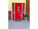 Red front door with sidelights and a gray doormat at 609 Rowan Mills Rd, Salisbury, NC 28147