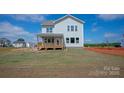 Expansive backyard featuring a cozy wooden deck, perfect for outdoor entertaining and relaxation at 4808 Glen Stripe Dr # Cal0036, Indian Trail, NC 28079