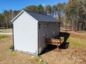 Gray sided two-story house with deck and wooded views at 1133 Heather Oak Ln, Oakboro, NC 28129