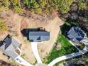 Community overview with new houses and landscaping at 1133 Heather Oak Ln, Oakboro, NC 28129