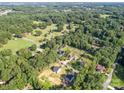 Expansive aerial view of the property, surrounded by lush trees and well-maintained neighborhood at 8932 Myra Way, Charlotte, NC 28215