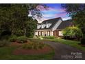 Brick home with landscaped yard and driveway at 721 Orphanage Rd, Concord, NC 28027