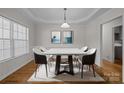 Bright dining area with modern light fixture and hardwood floors at 902 Snow Prince Ln, York, SC 29745