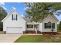 Charming single-story house with a white exterior and a two-car garage at 902 Snow Prince Ln, York, SC 29745