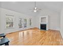 Spacious living room featuring hardwood floors, fireplace, and vaulted ceiling at 902 Snow Prince Ln, York, SC 29745