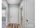 Bright entryway with white door and wood-look floors at 1517 28Th Street Se Pl, Hickory, NC 28602