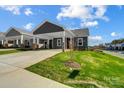 Gray house with carport and landscaped yard at 1529 28Th Street Se Pl, Hickory, NC 28602