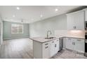 Modern kitchen featuring white shaker cabinets, granite countertops and stainless steel appliances at 2866 15Th Avenue Se Pl, Hickory, NC 28602