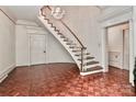Elegant foyer with a stunning chandelier and hardwood floors at 715 Saint Cloud Dr, Statesville, NC 28625