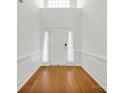 Bright entryway with hardwood floors and white wainscoting at 1801 Briarcrest Dr, Charlotte, NC 28269