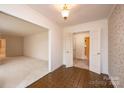 Spacious dining room featuring tile and carpet floors, neutral walls, and decorative lighting fixtures at 370 21St Nw Ave, Hickory, NC 28601