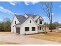 Modern farmhouse with attached garage and landscaping at 199 Heartland Dr # 10, Rock Hill, SC 29732