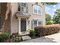 Inviting front entrance with elegant door, stylish accents, and well-maintained landscaping at 9341 Lenox Pointe Dr, Charlotte, NC 28273