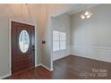 Bright entryway with hardwood floors and access to formal dining area at 125 Ariel Dr, Mooresville, NC 28117