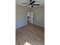 Bright bedroom featuring light-toned walls, ceiling fan, and hardwood-style flooring at 2280 Dale Earnhardt Blvd, Kannapolis, NC 28083