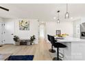 Bright hallway with light hardwood floors and neutral walls at 2600 Alleghany St, Charlotte, NC 28208