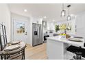 Modern white kitchen with stainless steel appliances and island at 2600 Alleghany St, Charlotte, NC 28208