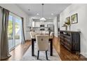 Kitchen and dining area with hardwood floors, and a view to backyard at 181 Atwater Landing Dr, Mooresville, NC 28117