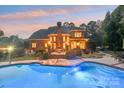 Luxury home with a large pool and plenty of outdoor space at 7025 Willow Trace Ln, Weddington, NC 28104