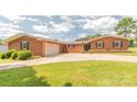Well-maintained brick ranch home with a spacious driveway and a two-car garage at 1405 Northcrest Dr, Albemarle, NC 28001