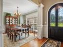 Elegant dining room with large table and chandelier at 418 Sebring Ct, Belmont, NC 28012