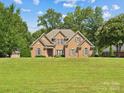 Brick house with a large green lawn at 418 Sebring Ct, Belmont, NC 28012