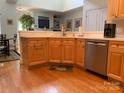 Bright kitchen featuring hardwood floors and stainless steel appliances at 19307 Beaufain St, Cornelius, NC 28031