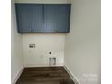 Laundry room with upper cabinets and vinyl flooring at 609 Hops Aly, Fort Mill, SC 29715