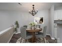 Charming dining room with a wooden table and gray chairs, perfect for dinner parties at 18741 Nautical Dr # 101, Cornelius, NC 28031