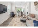 Cozy living room flows into kitchen with lots of light and open space at 4861 Blanchard Way, Charlotte, NC 28226