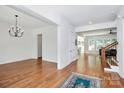 Bright entryway with hardwood floors, chandelier, and access to multiple rooms at 6178 Chimney Bluff Rd, Lancaster, SC 29720