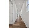 Bright hallway with hardwood floors leading to the living area at 730 Olde England Dr, Lincolnton, NC 28092