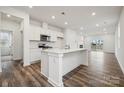 Modern kitchen featuring white cabinets, an island, and stainless steel appliances at 730 Olde England Dr, Lincolnton, NC 28092