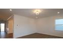 Spacious living room with hardwood floors and a view of the entryway at 10108 Whitaker Pointe Dr, Huntersville, NC 28078