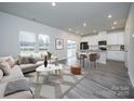 Open-concept living area featuring hardwood floors connecting to the kitchen and dining area at 104 Alden Ct, Shelby, NC 28152