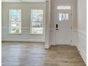 Bright foyer with wood-look floors, white trim and an inviting entrance at 2008 Embassy Ct # 45, Charlotte, NC 28213