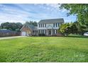 Charming brick and siding home with a well-manicured lawn and two-car garage at 106 Cameron Dr, Kings Mountain, NC 28086