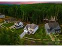 Gorgeous aerial view of a suburban neighborhood with lush green trees at 6034 Jepson Ct, Charlotte, NC 28214