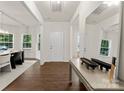 Bright foyer featuring hardwood floors, a mirror, and natural light at 6034 Jepson Ct, Charlotte, NC 28214
