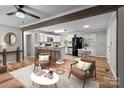Open floor plan with modern kitchen and living area with hardwood floors at 4972 Mayble St, Catawba, NC 28609